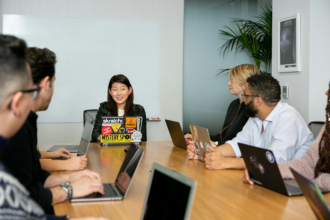 diverse team meeting about software